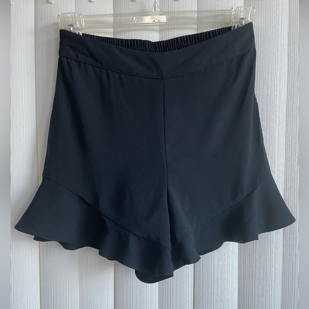 A new day dress shorts in black with scalloped trim. Size small. Like new.